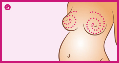 A pregnant woman with marked areas on her breasts.